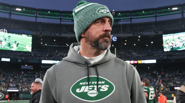 Aaron Rodgers walks off the field after a game.